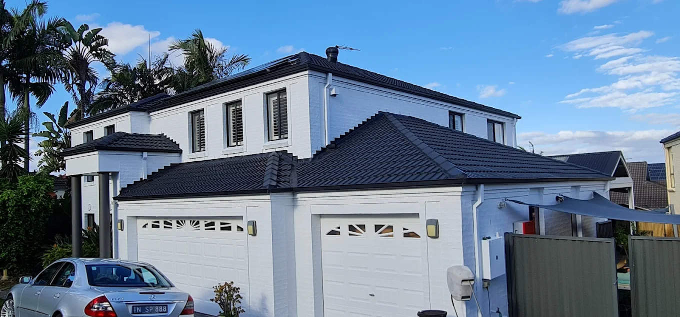 Beautifully painted white and charcoal exterior home in Canberra by Blue Painting & Decorating